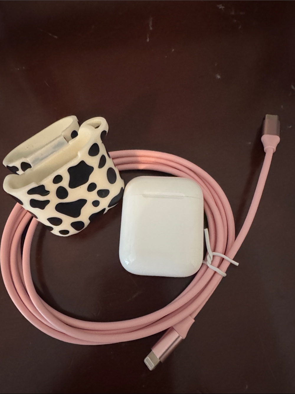 Apple AirPods 1st Generation + Pink Lightning Charging Cable with Cow Print Case